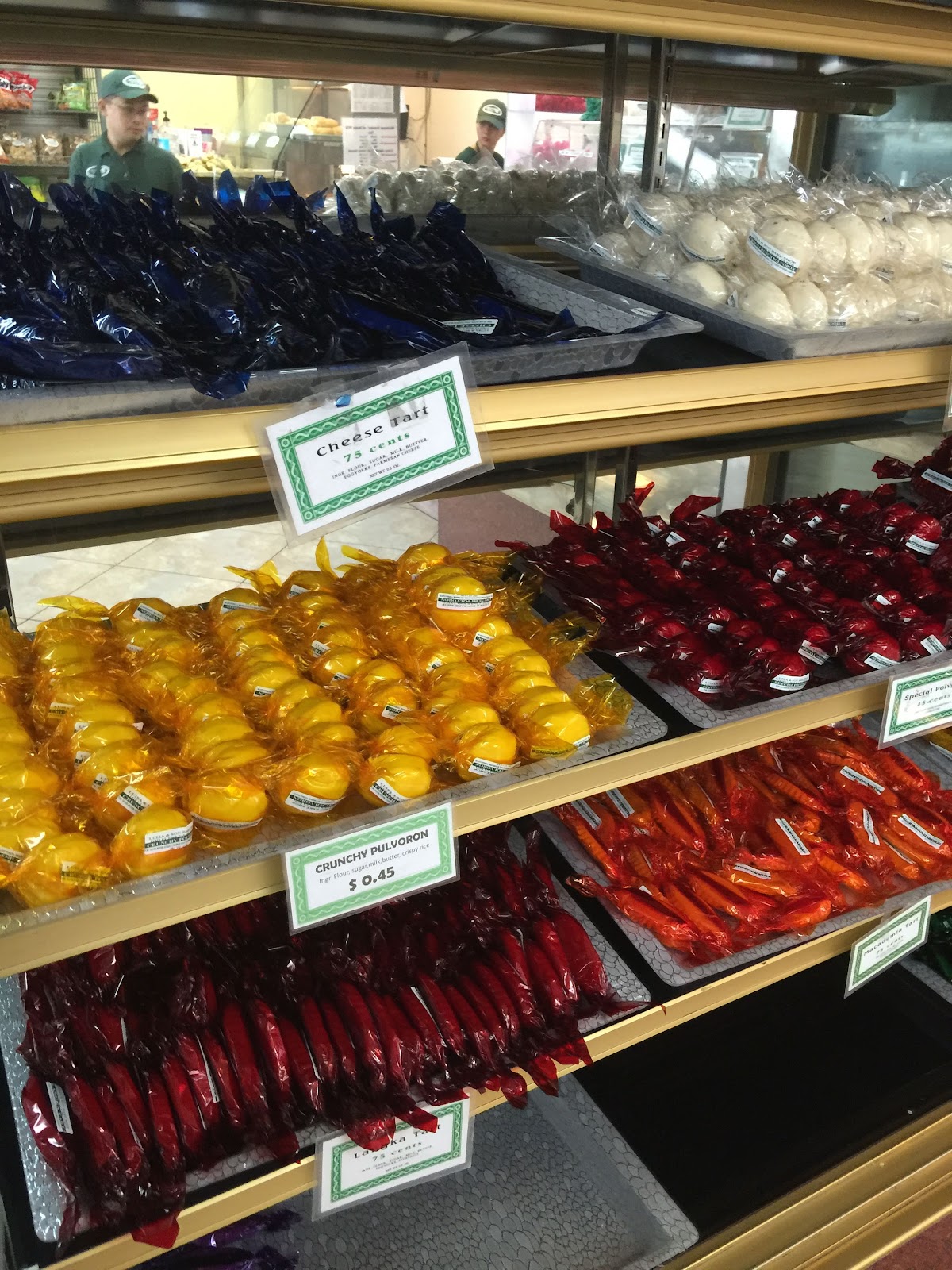 The pastry case with crunchy pulvoron, cheese tarts and langka tarts